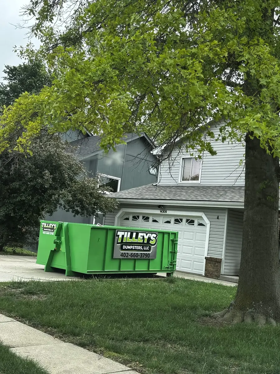 Tilley's green roll-off dumpster &mdash; Residential driveway