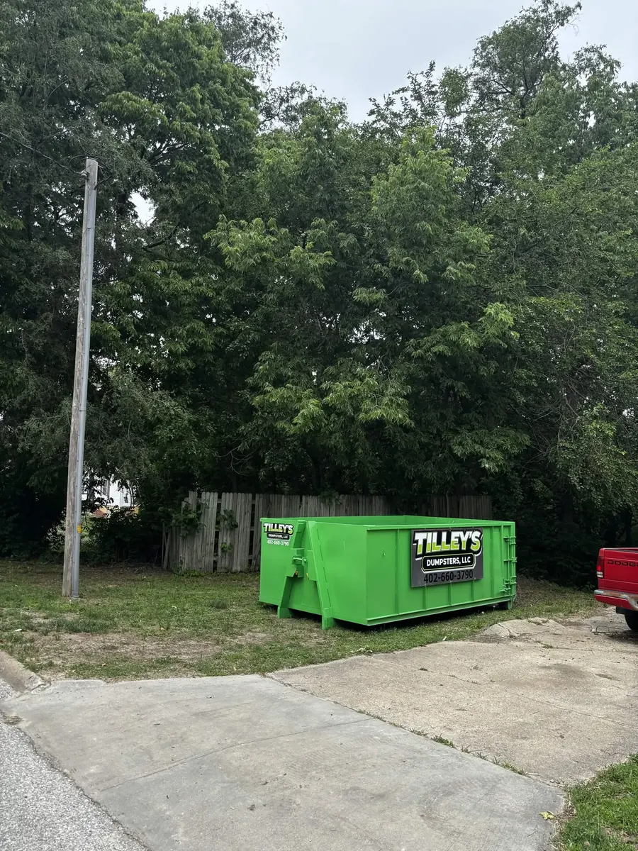 Tilley's green roll-off dumpster &mdash; Lot cleanup