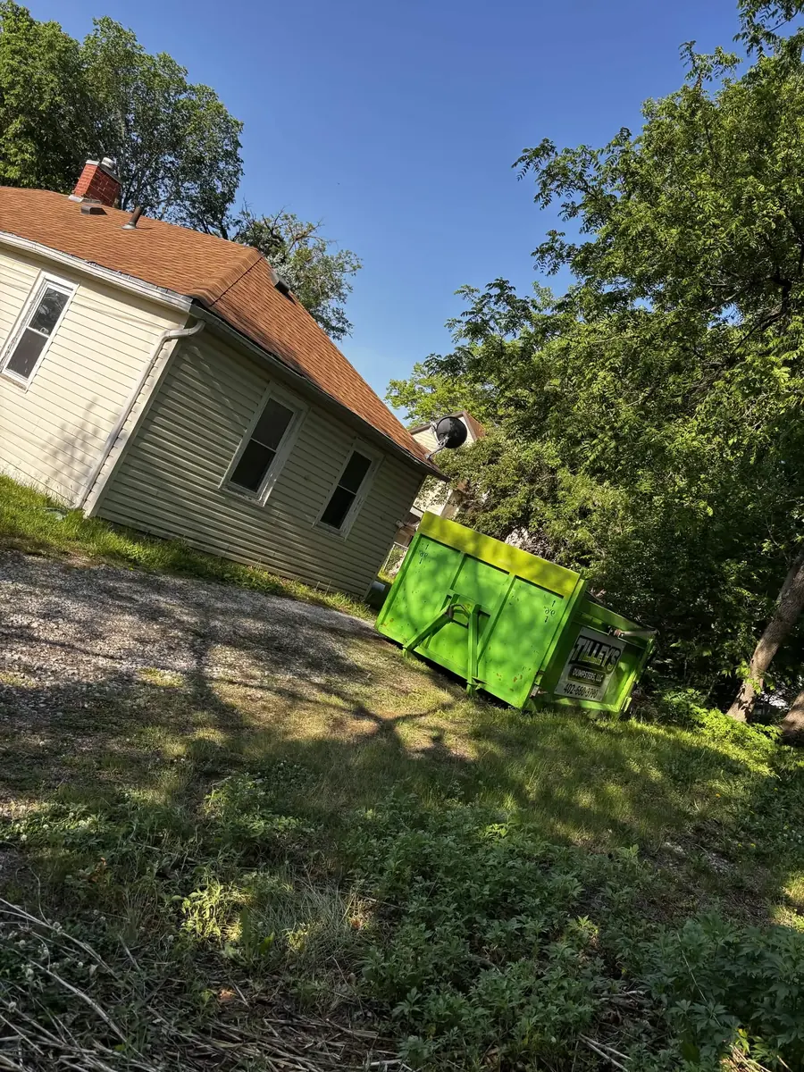 Tilley's green roll-off dumpster &mdash; Hillside job