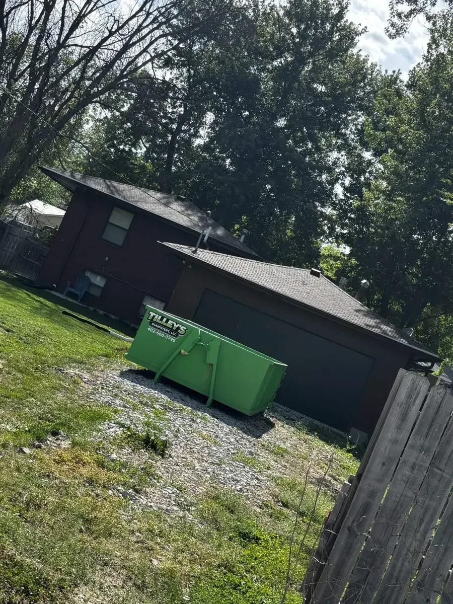 Tilley's green roll-off dumpster &mdash; Residential cleanup