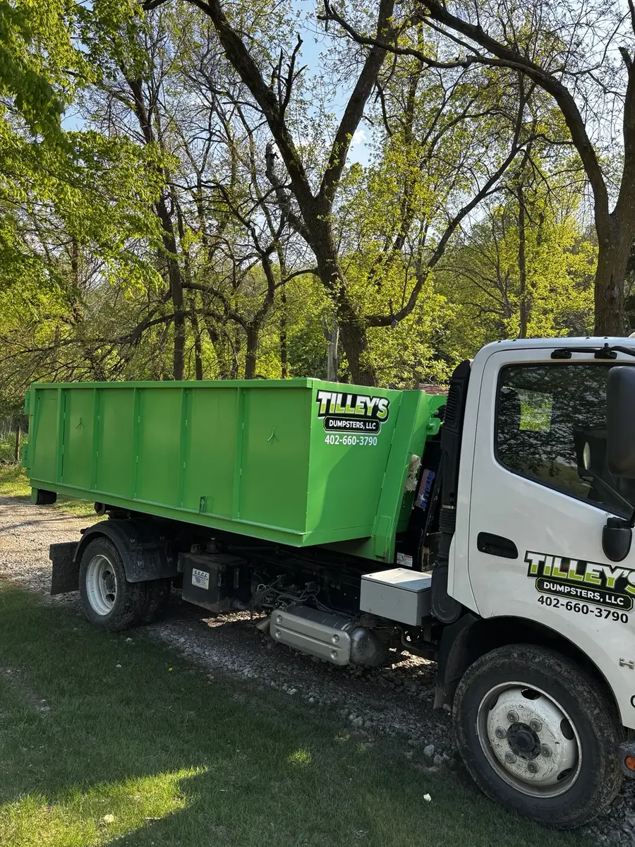 Tilley's green roll-off dumpster &mdash; Delivery day